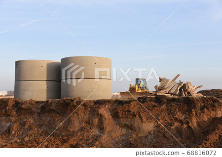 Laying of underground storm sewer pipes in ditch. 68816072