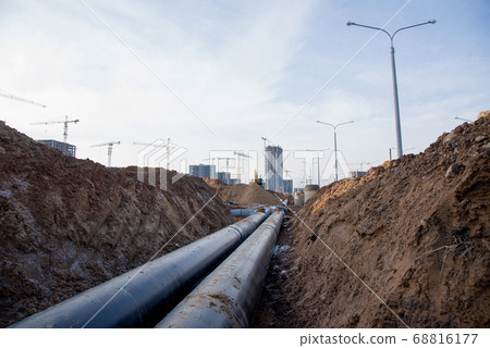 Laying of underground storm sewer pipes at the construction site 68816177