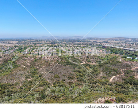 Aerial view of Los Penasquitos Canyon Preserve with Torrey Santa Fe middle neighborhood 68817511