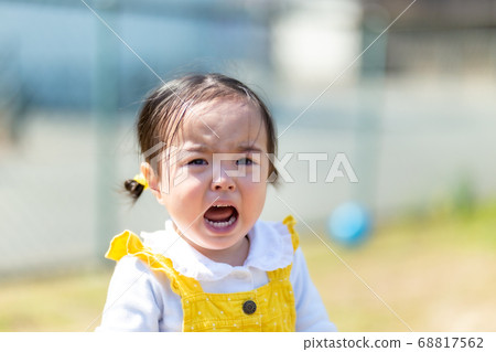 Cute girl with a crying face 68817562