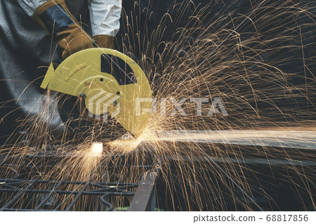 Hands of man with glove using electric steel 68817856