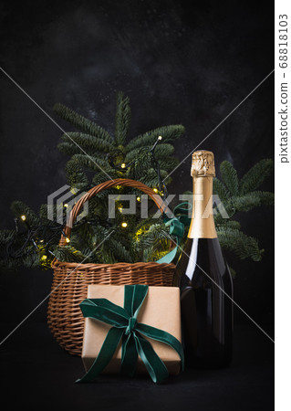 Holiday gift hamper with craft gift and sparkline wine on black. Christmas present. 68818103