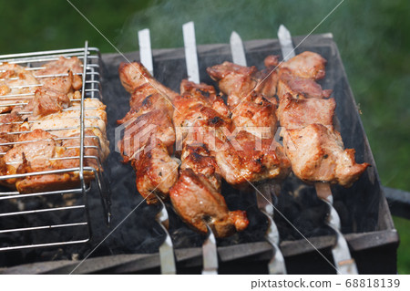 grill barbecue meat on a brazier with smoke, green grill barbecue meat on a brazier with smoke, green 68818139