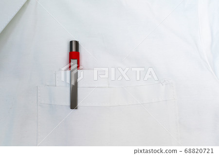 Rred pen in the front pocket of the doctor's white coat 68820721