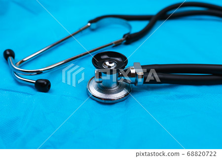 Stethoscope and phonendoscope on the blue medical fabric 68820722