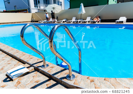 Modern outdoor luxurious swimming pool. Vacation concept 68821245