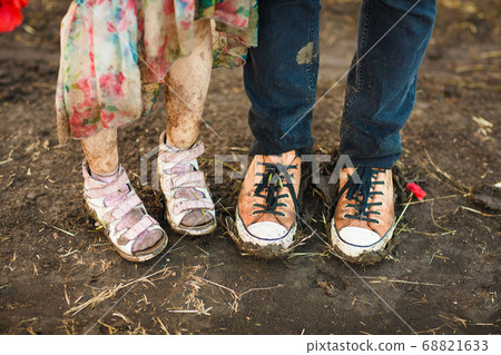 dirty shoes. goes in road after rain.  68821633