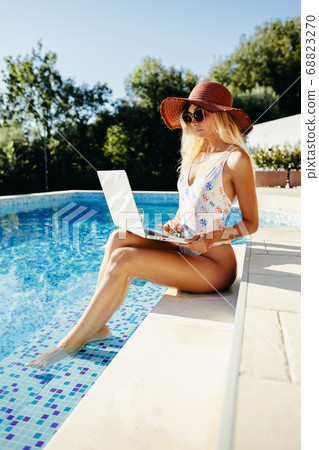 woman using laptop for blogging and online study 68823270