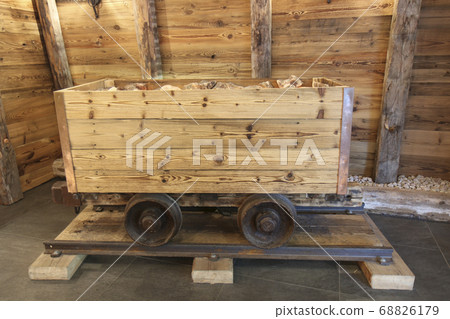 The Antique ore wood cart on rails. The Antique ore wood cart on rails. 68826179