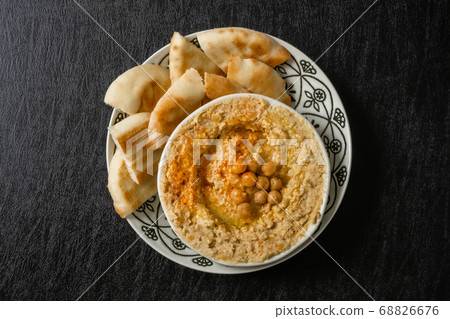 Hummus Middle Eastern food chickpeas and olive oil sauce (hummus) Hummus Middle Eastern food chickpeas and olive oil sauce (hummus) 68826676