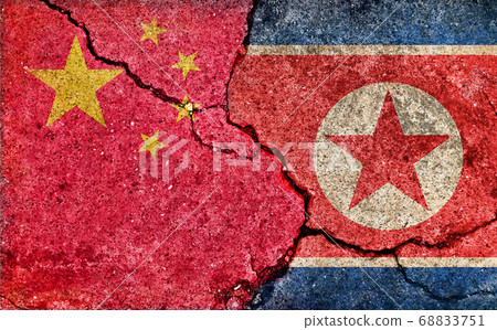 International conflict/political conflict / dirty flag illustration (China vs. North Korea) / cracked concrete wall 68833751