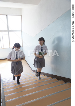 Junior high school student climbing the stairs 68834001
