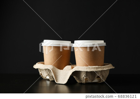 Eco - friendly coffee cups on black background, Eco - friendly coffee cups on black background, 68836121