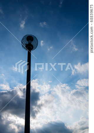 Streetlight floating in the blue sky Streetlight floating in the blue sky 68839675