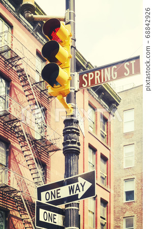 New York City street signs and traffic lights at Spring Street. New York City street signs and traffic lights at Spring Street. 68842926