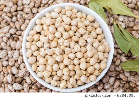 beans and chickpeas in porcelain bowl 68845093