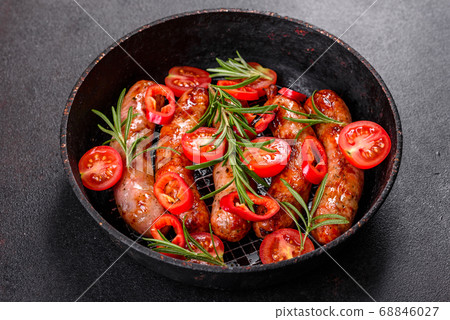 Grilled sausages with vegetables and spices on Grilled sausages with vegetables and spices on 68846027