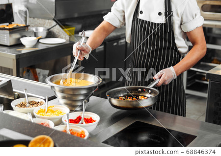 Restaurant chef cooking italian mirepoix sauting 68846374