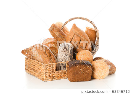 Bakery products in straw basket isolated on white Bakery products in straw basket isolated on white 68846713