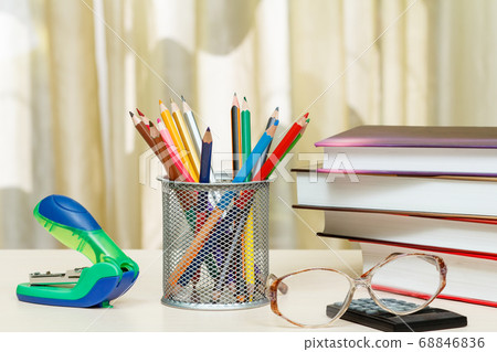 School supplies. Books, colour pencils, glasses, 68846836