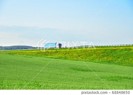 Truck with Semi-trailer driving along highway 68848650