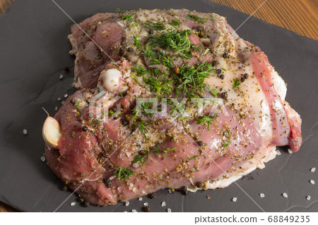 raw turkey meat, some thigh stuffed with garlic raw turkey meat, some thigh stuffed with garlic 68849235