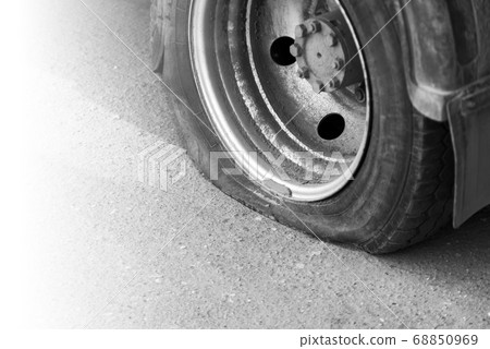 A flat tire of car 68850969