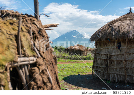 Traditional Maasai Village with Clay Round Huts in Engare Sero area near Lake Natron and Ol Doinyo Lengai volcano in Tanzania, Africa Traditional Maasai Village with Clay Round Huts in Engare Sero area near Lake Natron and Ol Doinyo Lengai volcano in Tanzania, Africa 68851550