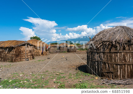 Traditional Maasai Village with Clay Round Huts in Engare Sero area near Lake Natron and Ol Doinyo Lengai volcano in Tanzania, Africa 68851598