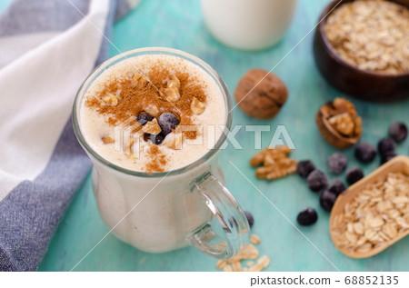 Oatmeal porridge with blueberries and almonds. Oatmeal porridge with blueberries and almonds. 68852135