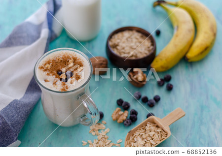 Oatmeal porridge with blueberries and almonds. Oatmeal porridge with blueberries and almonds. 68852136