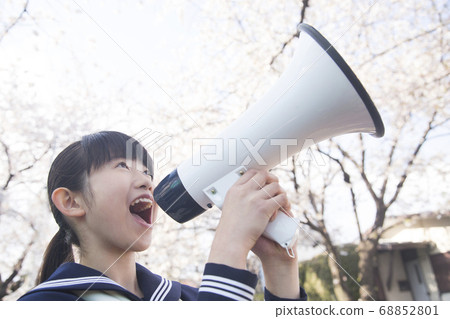 Female junior high school students cheering with a loudspeaker Female junior high school students cheering with a loudspeaker 68852801