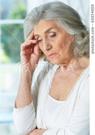 Close up portrait of sad senior woman Close up portrait of sad senior woman 68854009