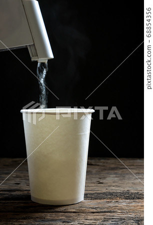 Noodle in a white bowl with Hot pot on wooden Noodle in a white bowl with Hot pot on wooden 68854356