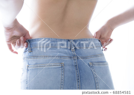 Woman wearing denim pants 68854581