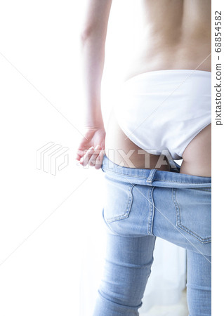 Woman wearing denim pants Woman wearing denim pants 68854582