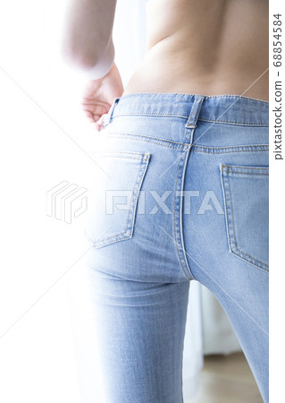 Woman wearing denim pants Woman wearing denim pants 68854584