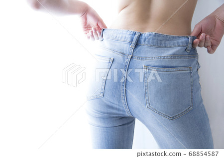 Woman wearing denim pants 68854587