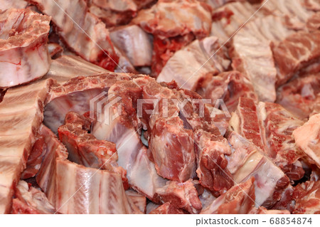 Closeup pile of raw pork ribs for cooking. Closeup pile of raw pork ribs for cooking. 68854874