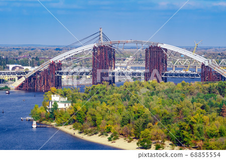 Construction of a bridge over the river. Temporary Construction of a bridge over the river. Temporary 68855554
