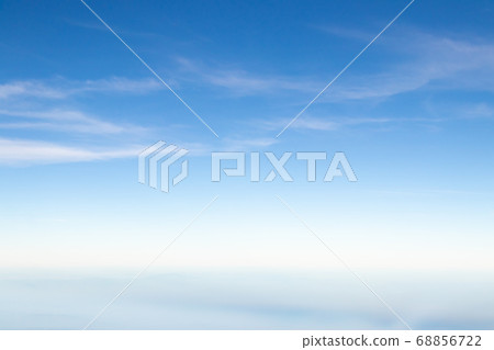 Clear blue sky with white cloud background 68856722