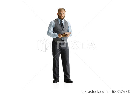 Cheerful handsome businessman isolated over white studio background 68857688