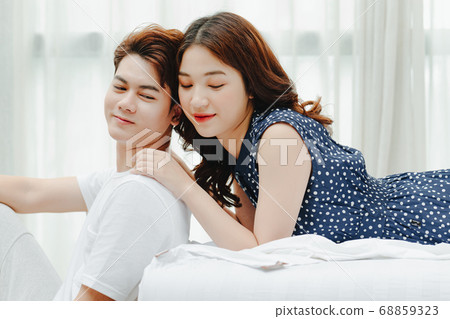 Happy couple in bed 68859323