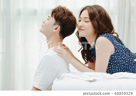 Happy couple in bed 68859329