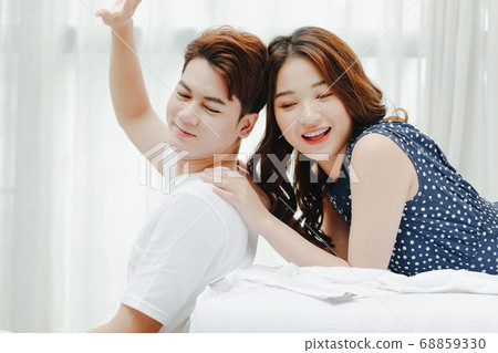 Happy couple in bed 68859330