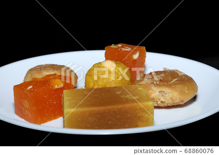 Indian sweets served in white plate. Halwa, Indian sweets served in white plate. Halwa, 68860076