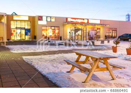 A table with a bench for resting covered with snow A table with a bench for resting covered with snow 68860491