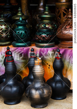 Showcase with clay pots from handmade jugs. Asian 68860605