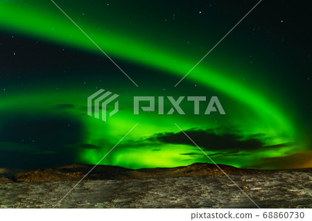 Northern lights in the night sky of iceland. Soft Northern lights in the night sky of iceland. Soft 68860730