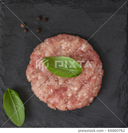Raw fresh beef burgers or cutlet with pepper 68860762